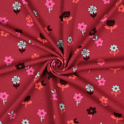 Tissu Jersey Nid d&#039;abeille imprimé Fleurs sur fond Framboise - Par 10 cm