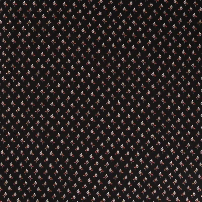 Tissu Viscose  Petites fleurs rouge et doré sur fond Noir - Par 10 cm