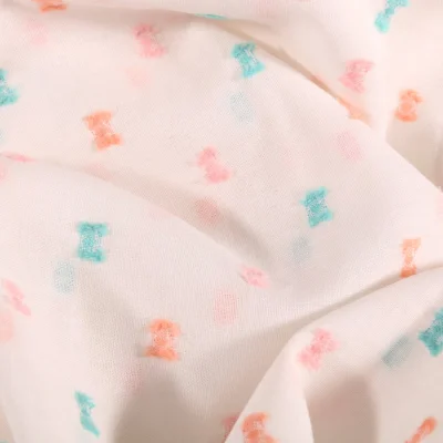 Tissu Plumetis Coton léger Petits nœuds pastels sur fond Blanc - Par 10 cm