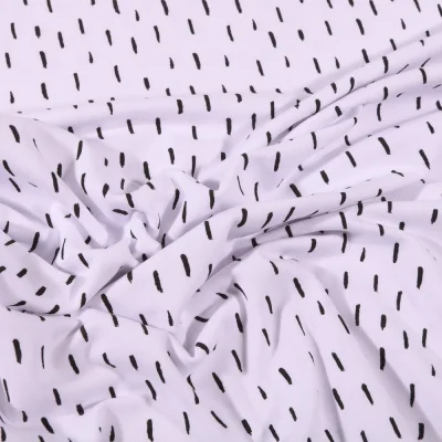 Tissu Jersey Coton Bio Pointillés noirs sur fond Blanc - Par 10 cm
