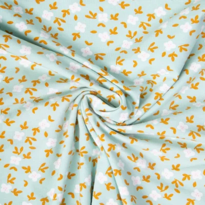 Tissu Jersey Coton Petites pensées sur fond Vert menthe - Par 10 cm