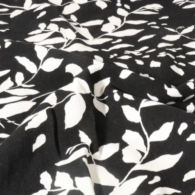 Tissu Viscose imprimé Feuillage blanc sur fond Noir - Par 10 cm