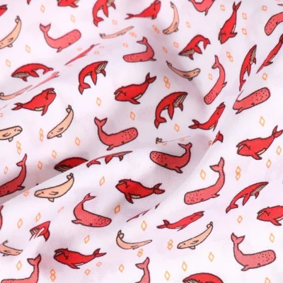 Tissu Jersey Coton Baleines rouges sur fond Blanc - Par 10 cm