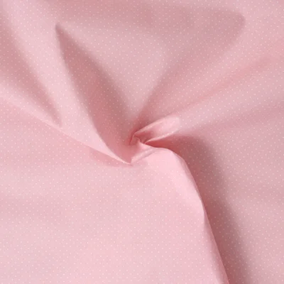 Tissu Polycoton  Dottie pois Blancs sur fond Rose pâle - Par 10 cm