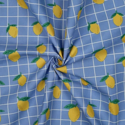Tissu Coton enduit Poppy Citrons et carreaux sur fond Bleu - Par 10 cm