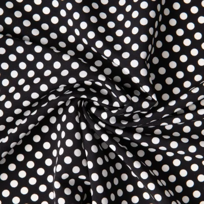 Tissu Crêpe léger Pois blancs sur fond Noir - Par 10 cm