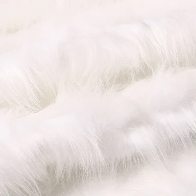Tissu Fausse fourrure Fantasia sur fond Blanc - Par 10 cm