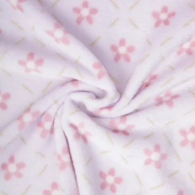 Tissu Doudou imprimé petites fleurs Rose sur fond Parme - Par 10 cm