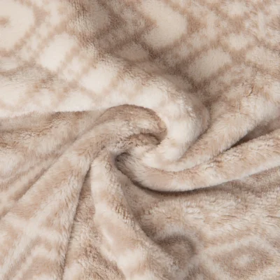 Tissu Doudou imprimé motif losanges et chevrons sur fond Beige clair - Par 10 cm