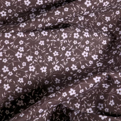 Tissu Popeline Coton Bio Petites fleurs blanches sur fond Gris - Par 10 cm