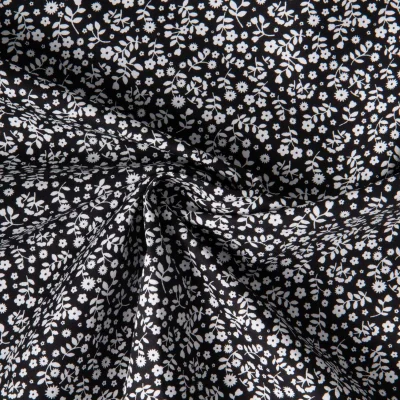 Tissu Coton imprimé Lutos Mina sur fond Noir - Par 10 cm