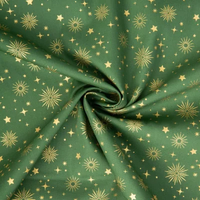 Tissu Coton imprimé étoiles dorés de noël sur fond Vert - Par 10 cm