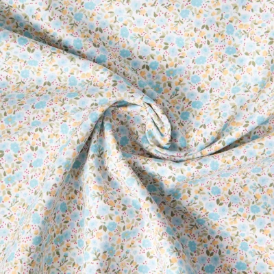 Tissu Coton imprimé Liberté floral jaune bleu sur fond Blanc - Par 10 cm