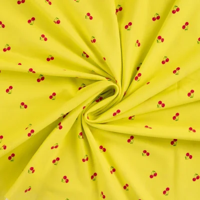 Tissu Jersey Coton imprimé Cerises rouges sur fond Jaune - Par 10 cm