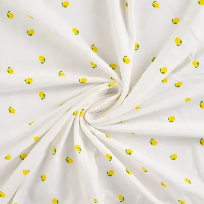 Tissu Jersey Coton imprimés Citrons jaunes sur fond Ecru - Par 10 cm