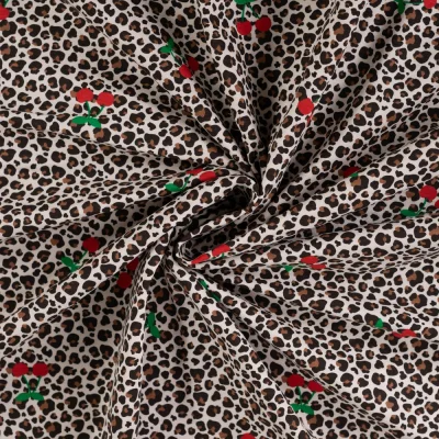 Tissus Jersey Coton imprimé Cerises et léopard sur fond Ecru - Par 10 cm