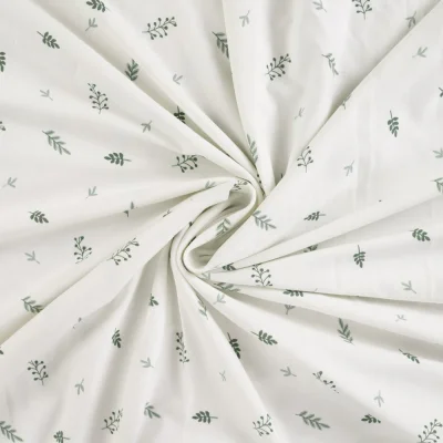 Tissus Jersey Coton imprimé Branches sur fond Blanc cassé - Par 10 cm