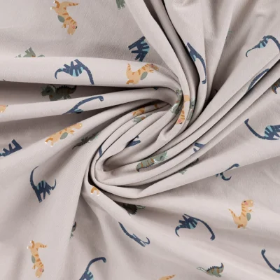 Tissu Jersey Coton imprimé Noé gentils dinosaures sur fond Beige - Par 10 cm