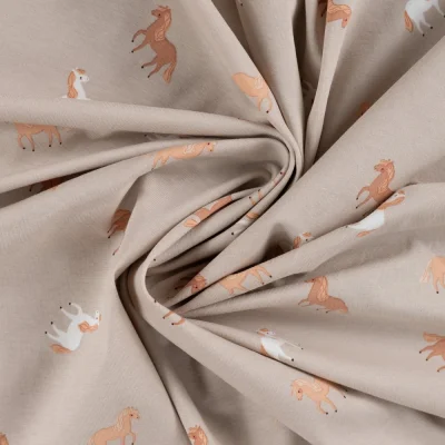 Tissu Jersey Coton imprimé Sacha petits chevaux sur fond Beige - Par 10 cm