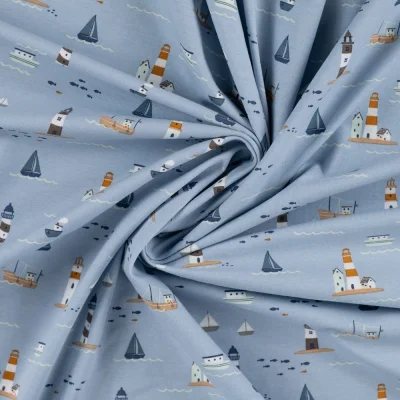 Tissu Jersey Coton imprimé Eliott phares et bateaux sur fond Bleu ciel - Par 10 cm