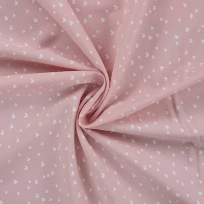 Tissu Popeline de  Coton  cœurs blancs Zivy sur fond Rose - Par 10 cm