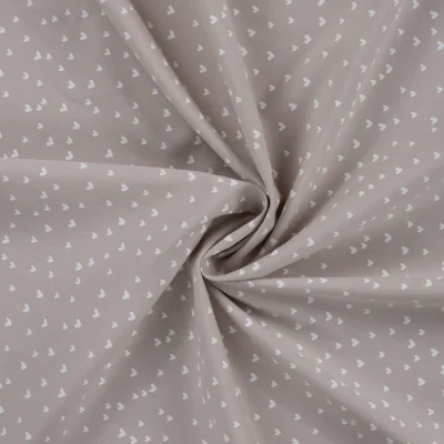 Tissu Popeline de  Coton  cœurs blancs Zivy sur fond Taupe - Par 10 cm