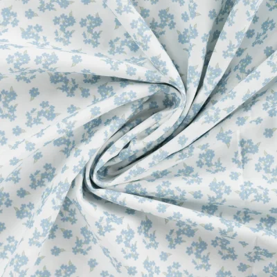 Tissu Popeline de Coton Charlotte petites fleurs Bleu sur fond Blanc - Par 10 cm