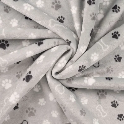 Tissu Doudou imprimé Patte de chien et os sur fond Gris clair - Par 10 cm