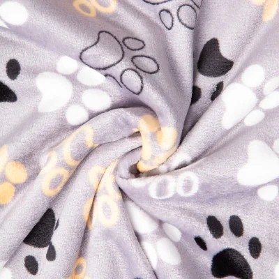 Tissu Doudou imprimé empreintes pattes sur fond Gris - Par 10 cm