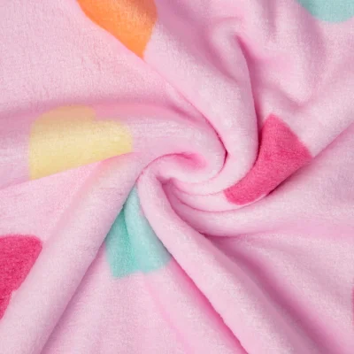 Tissu Doudou imprimé Coeurs multi sur fond Rose bébé - Par 10 cm