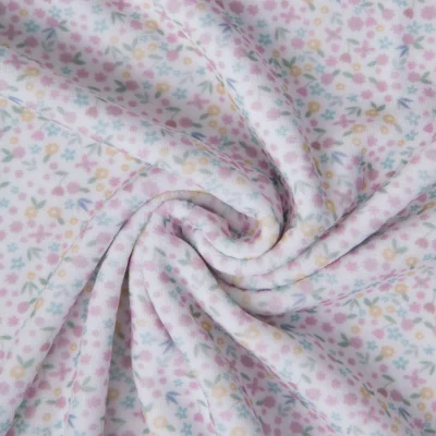 Tissu Jersey Velours Eponge digital Tapis fleuri sur fond Blanc - Par 10 cm