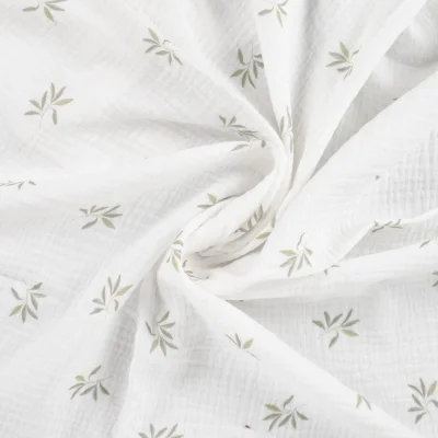 Tissu Double gaze de Coton Feuillages sur fond Blanc cassé - Par 10 cm