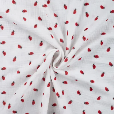 Tissu Double gaze de Coton Coccinelles rouges sur fond Blanc - Par 10 cm