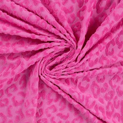 Tissu Maille motif léopard éponge sur fond Rose fuchsia - Par 10 cm