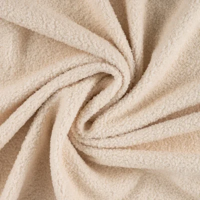 Tissu Bouclette Teddy envers Polaire uni Crème - Par 10 cm