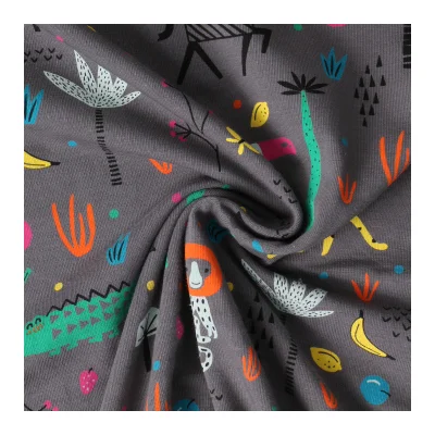 Tissu Jersey Coton imprimé Animaux de la savane sur fond Gris anthracite - Par 10 cm