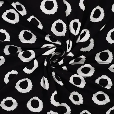 Tissu Jersey Viscose Iris Cercles Noir et Blanc sur fond Noir - Par 10 cm