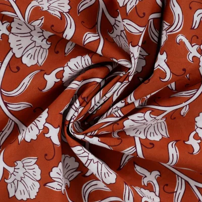 Tissu Voile de Coton Aarohi Arabesques Végétales sur fond Terracotta - Par 10 cm