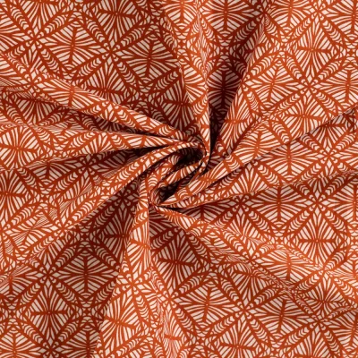 Tissu Voile de Coton Graphique Hypnotique sur fond Terracotta - Par 10 cm