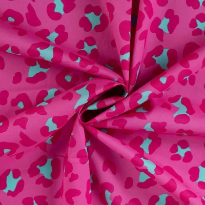 Tissu Voile de Coton Léopard Pop Turquoise sur fond Rose fuchsia - Par 10 cm