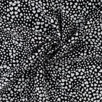 Tissu Viscose imprimé Petits coeurs blancs sur fond Noir - Par 10 cm