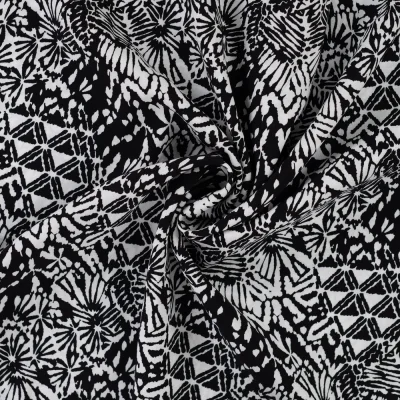 Tissu Viscose imprimé Motifs blancs destructurés sur fond Noir - Par 10 cm