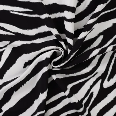 Tissu Viscose imprimé Motif zébré sur fond Noir - Par 10 cm