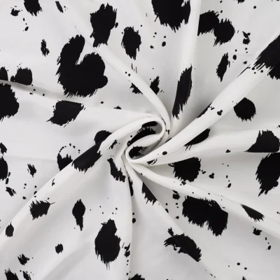 Tissu Viscose imprimé Taches noires éclatées sur fond Blanc - Par 10 cm
