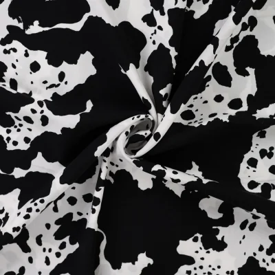 Tissu Viscose imprimé Taches noires sur fond Blanc - Par 10 cm