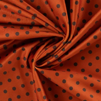 Tissu Velours ras d&#039;habillement digital pois Noir sur fond Terracotta - Par 10 cm