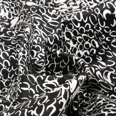 Tissu Coton Satiné extensible Merina sur fond Noir - Par 10 cm