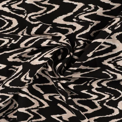Tissu Viscose aspect Lin Waves beige sur fond Noir - Par 10 cm