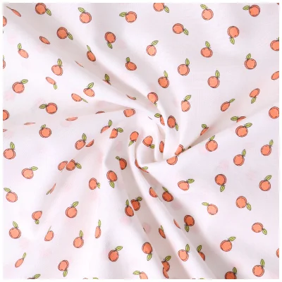 Tissu Popeline de Coton Petites pêches sur fond Blanc - Par 10 cm
