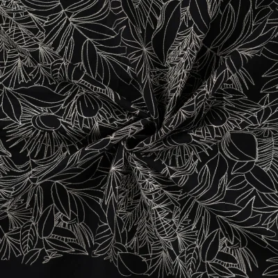 Tissu Coton brodé imprimé Floral sur fond Noir - Par 10 cm